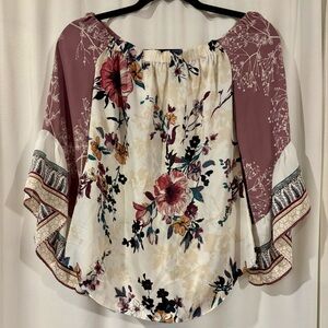 White House Black Market. Adorable multi pattern, off shoulder blouse.